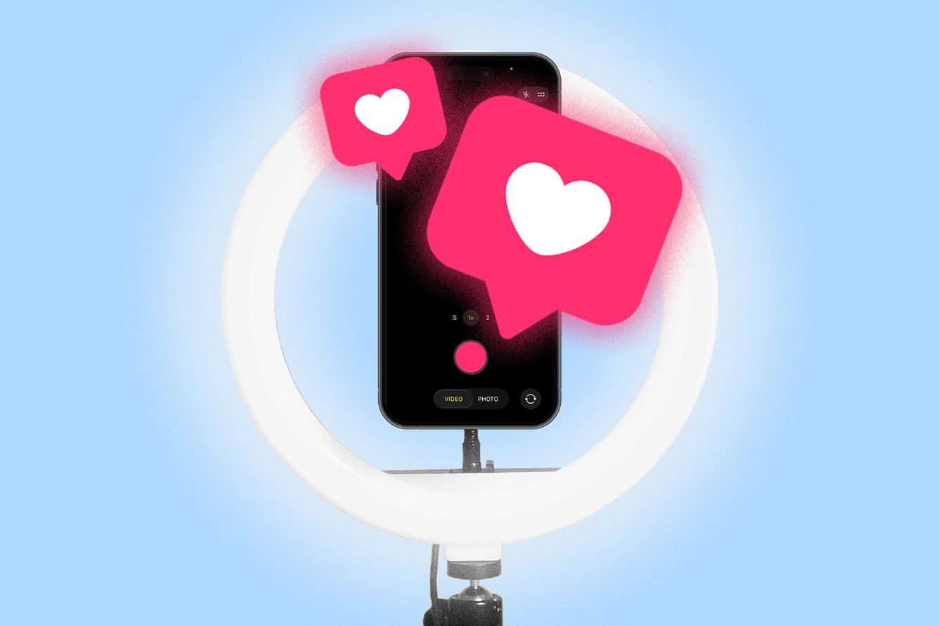 A ring light with a smartphone and social media like buttons